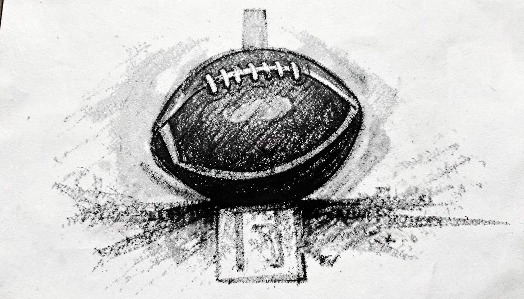 A bold charcoal drawing of a football resting on a yard-line marker, deep blacks and soft gray shading